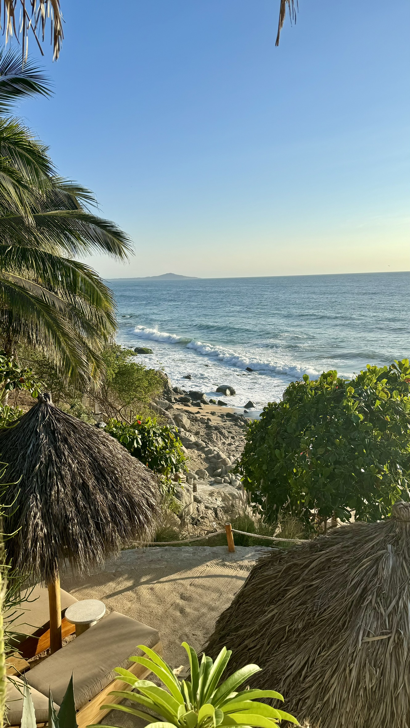 Sayulita beach cove with palapa umbrellas and palm trees, Mexico — Kristin's photo, April 2024